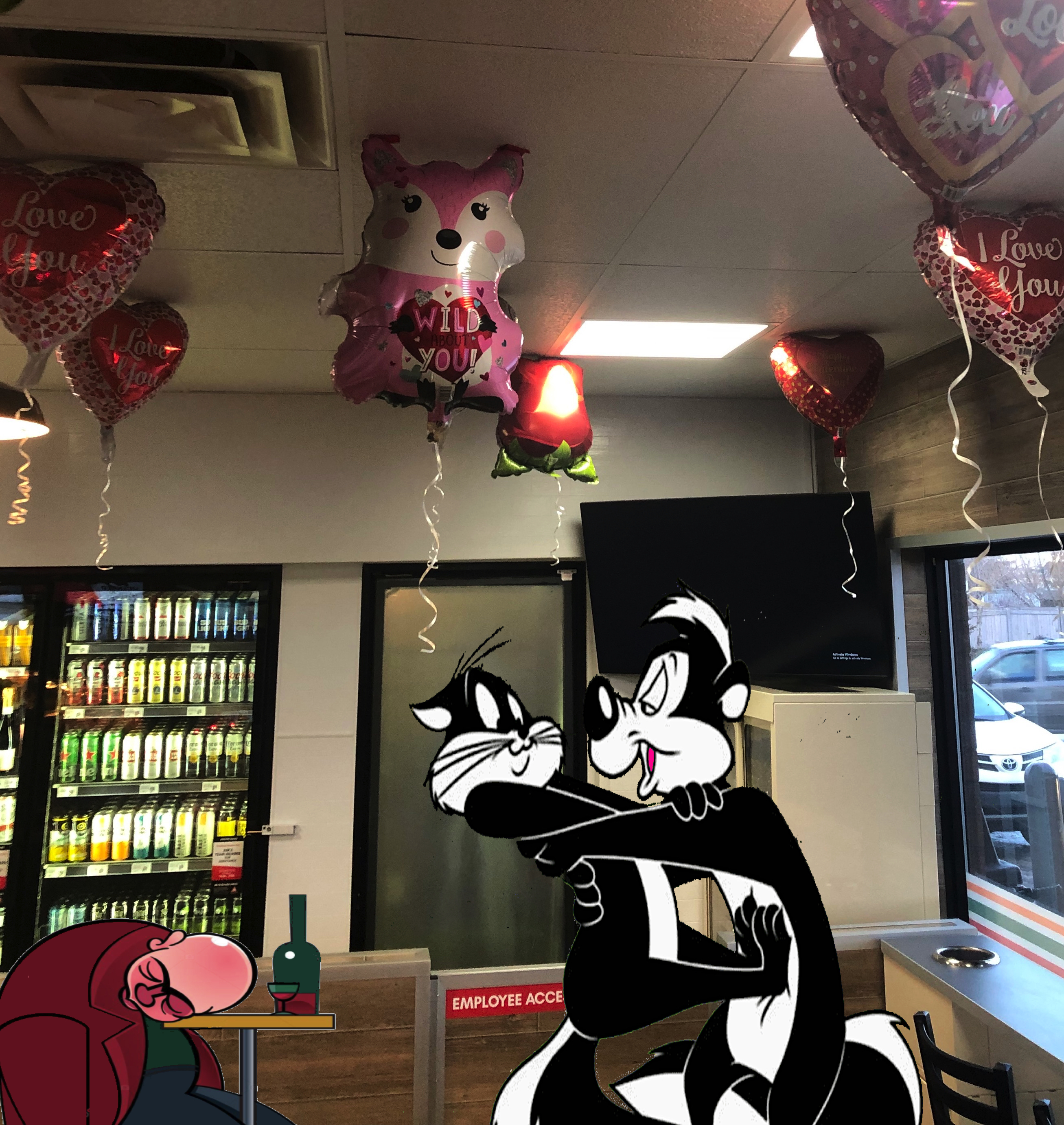A shot of the dining area with a cartoon skunk trying to kiss a reluctant black cat. An unconscious man is behind them at a table. 