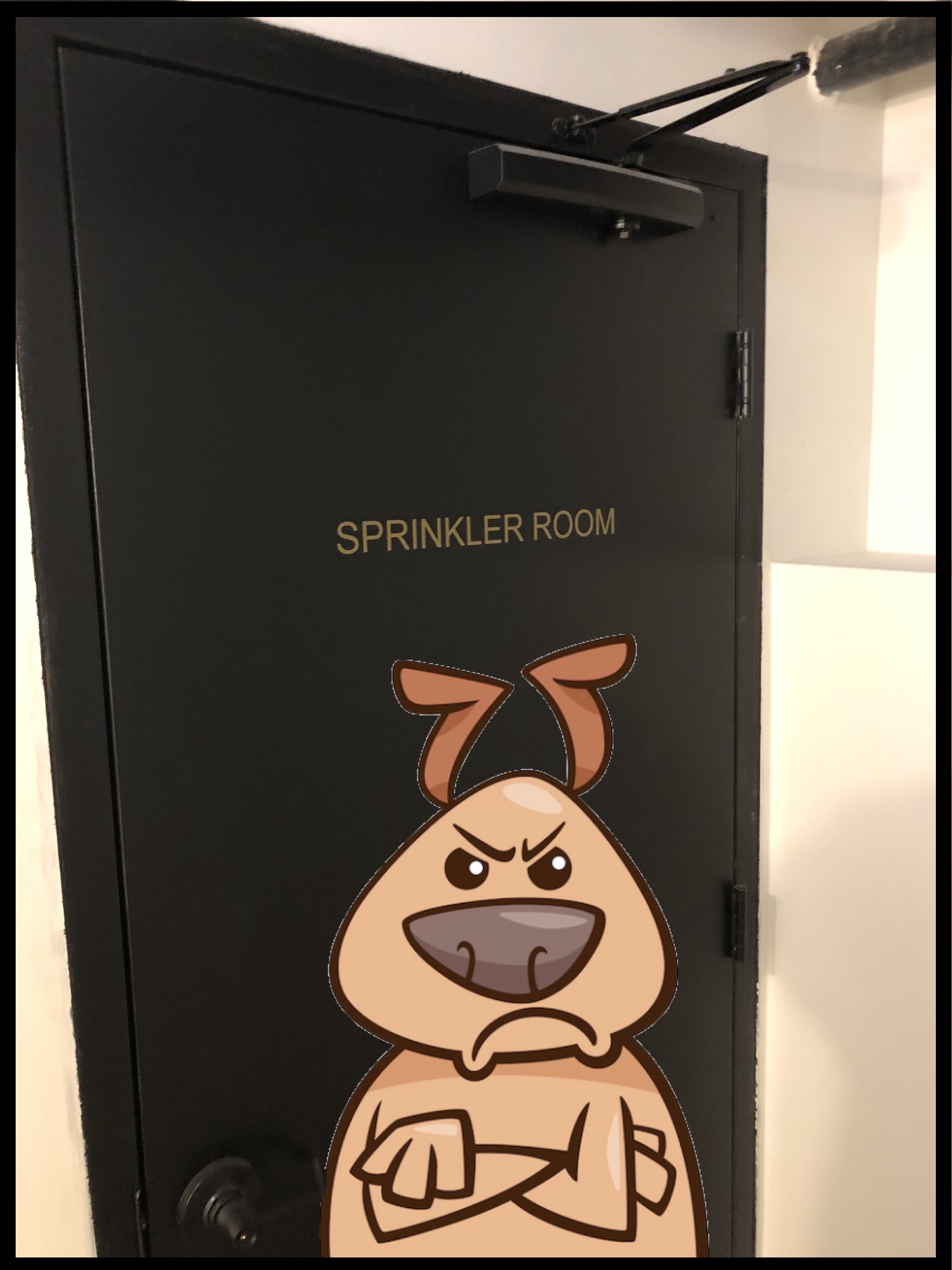 A door that says "Sprinkler Room" with a dog looking disgruntled. 