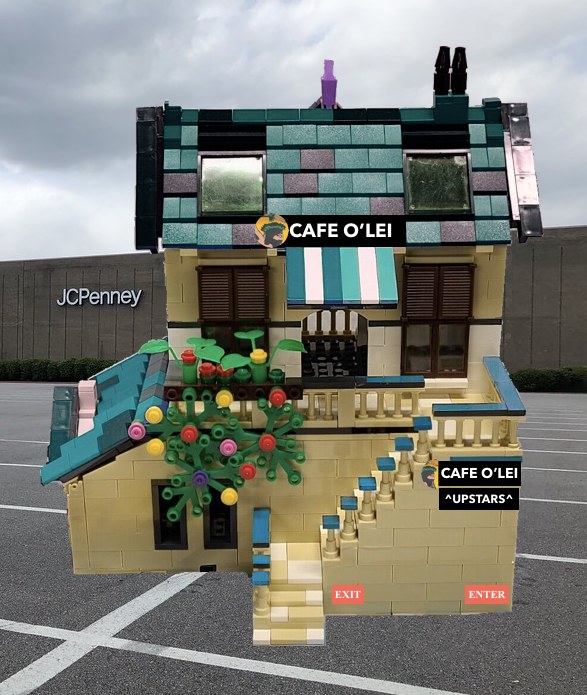 Lego set with Café O'Lei signage, set up in a JC Penny parking lot.