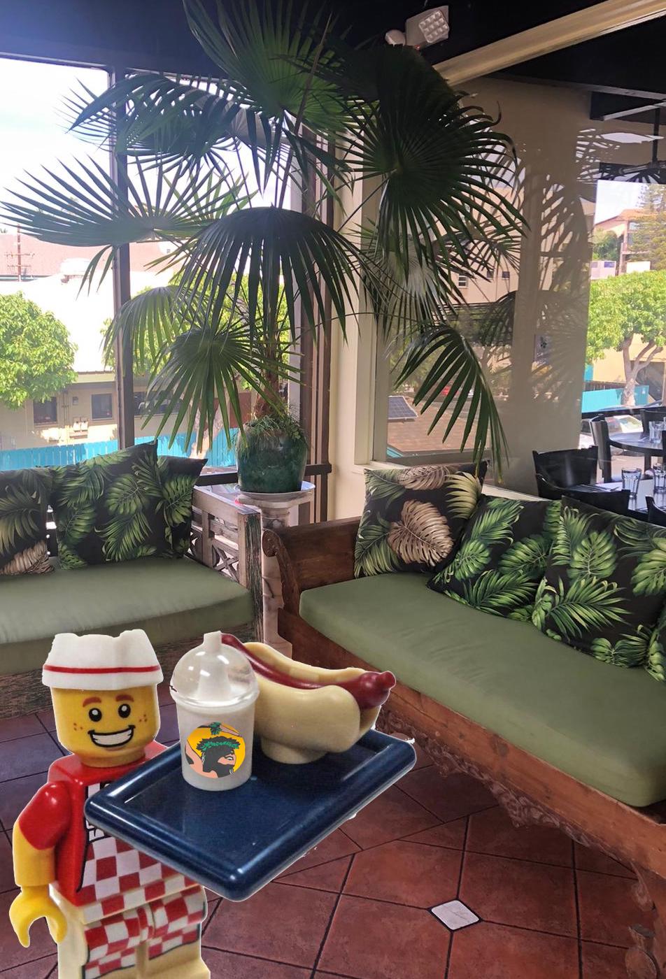 Lobby of Cafe O'Lei Maui with Lego man serving a hot dog. 